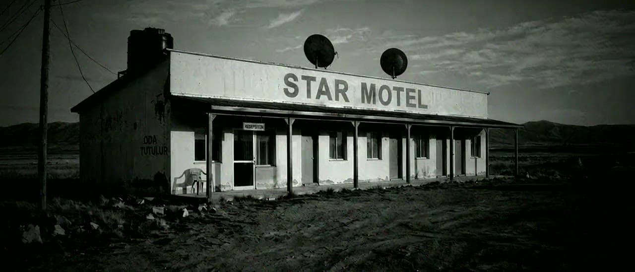 Opening frame of the showreel: a roadside motel in black and white, from Anadolu Sofrası.
